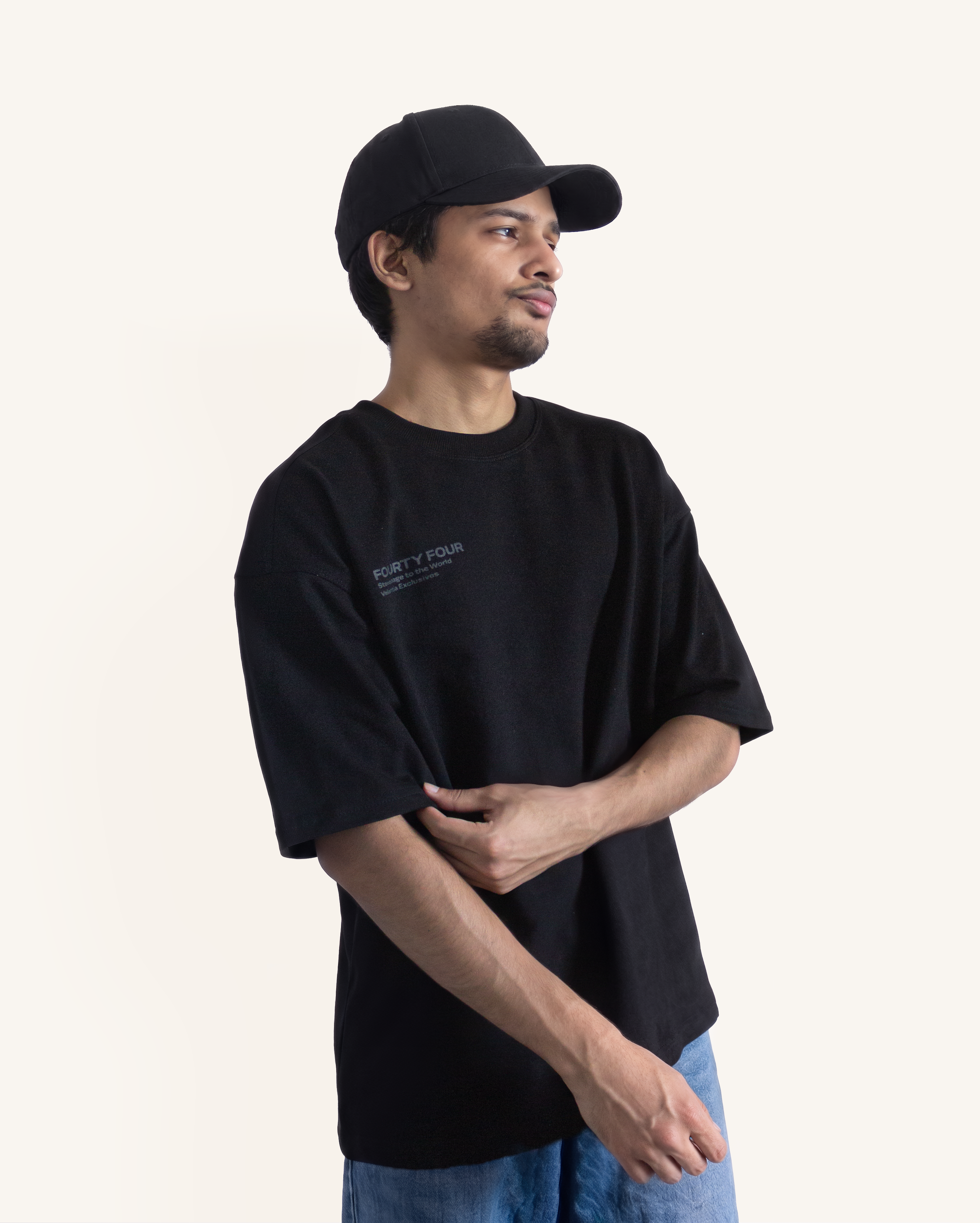Velentia black motorsport minimal T-shirt front view with relaxed boxy fit on model