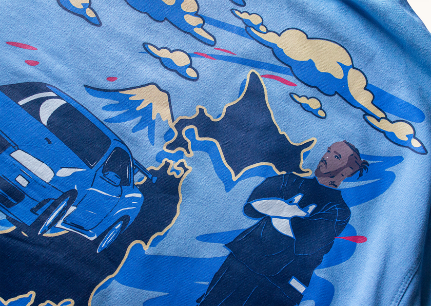Close-up of Velentia summer sky blue Tokyo T-shirt showing detailed motorsport and JDM inspired graphic print